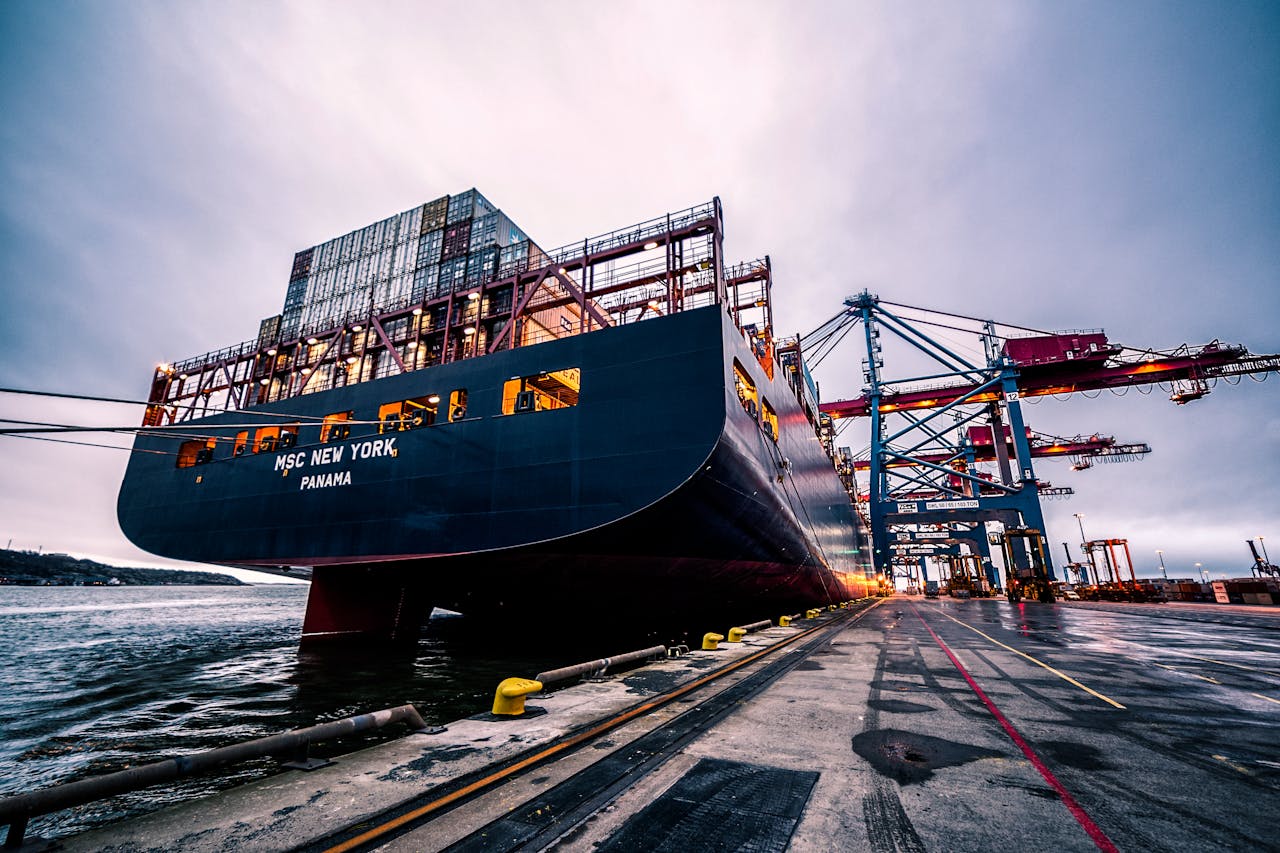 Services-03 A large cargo ship docked at Gothenburg port with industrial cranes, Sweden.