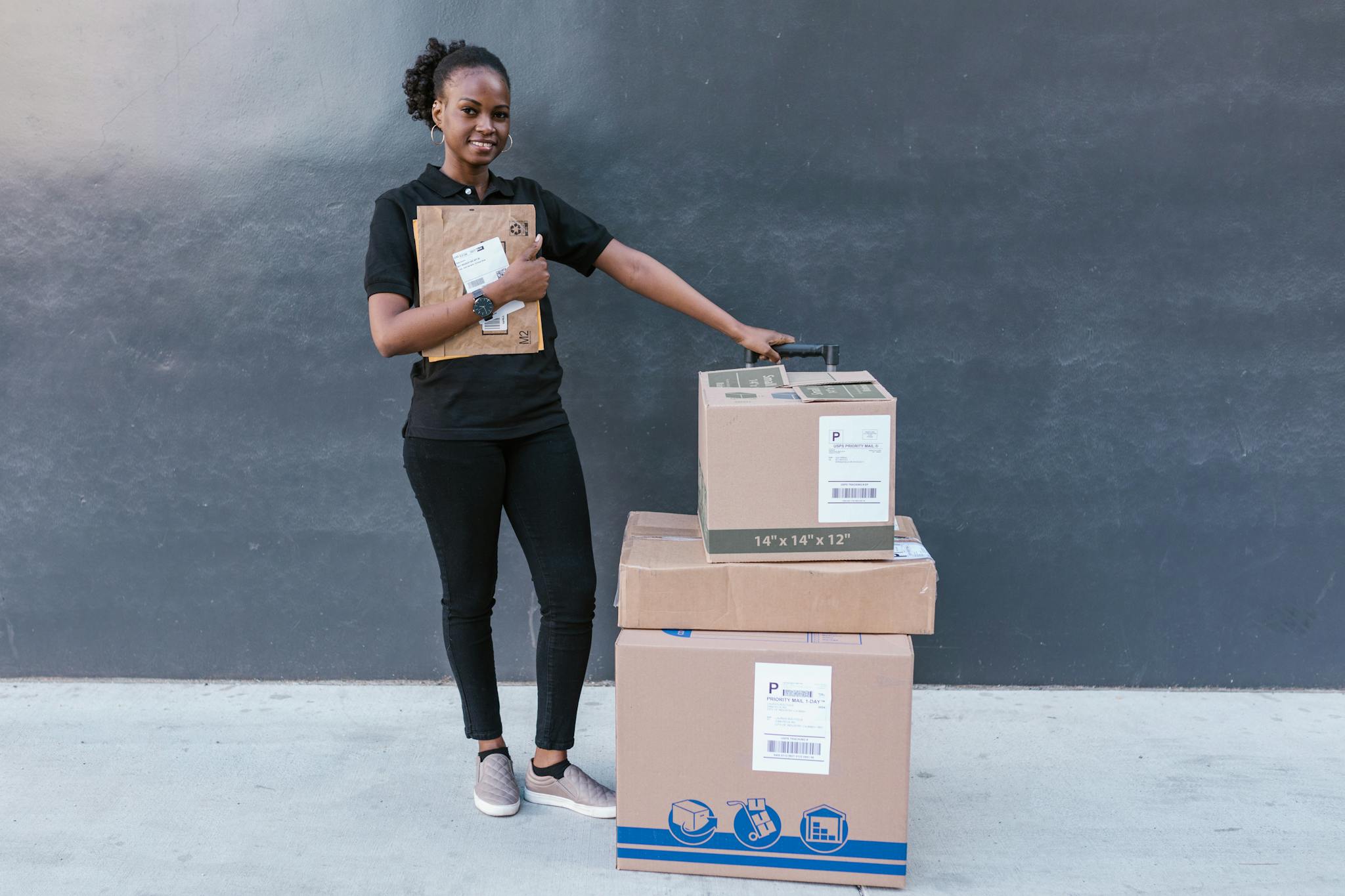 About Confident woman holding delivery packages against a modern backdrop.